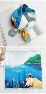 Detail of artistic seaside print square scarf tied as an elegant neck bow on a magazine
