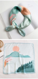 Detail of mint green square silk scarf with Japanese landscape print and floral pattern
