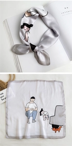 Detailed view of square silk scarf with hand-drawn cartoon prints and gray rolled edges