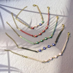 Set di cinque braccialetti intrecciati malocchio con catene placcate oro 18K e chiusura a moschettone