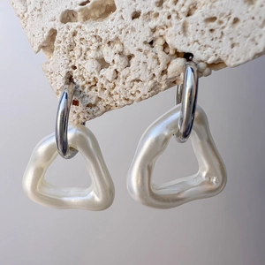 Minimalist geometric hollow triangle earrings with silver hoops and pearl drop design