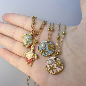 18K gold plated ocean series necklace with colorful enamel sea turtle and starfish pendants