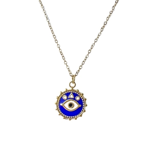 Vintage stainless steel evil eye necklace with golden sunburst pendant on white background