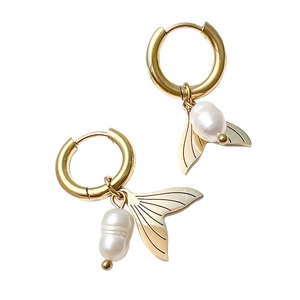 Fashionable gold stainless steel fishtail earrings with elegant white pearls on white background