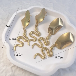 Snake drop earrings in 18K gold plated stainless steel with textured serpent design