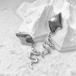 Silver textured snake drop earrings with irregular geometric studs in a minimalist style