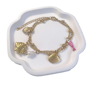 Bracelet double rang en acier inoxydable doré avec étoile de mer, poisson et perles