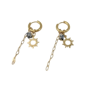 Gold sun charm earrings with stainless steel chains and marble stone cubes on white background