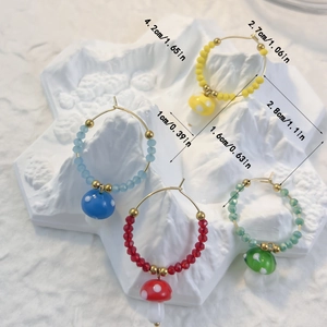 Handmade glass mushroom hoop earrings in blue, yellow, red and green colors