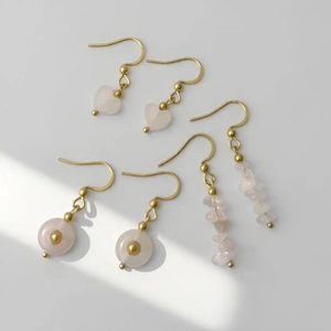Detailed set of three gold hooks with pink quartz heart, disc, and chip stone earrings