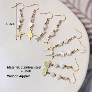 Set of 4 gold stainless steel dangle earrings with white star and heart shell charms