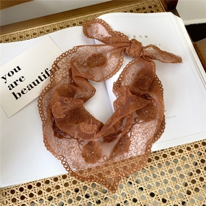 Floral lace triangular scarf in brown with vintage embroidery on white magazines