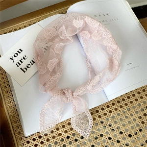Pink floral lace triangle headscarf with delicate embroidery on a minimal white background