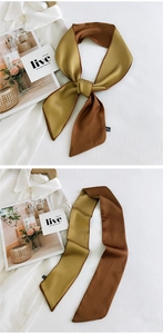 Detail of double-sided satin skinny scarf in mustard yellow and caramel brown colors