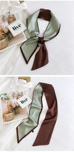 Close-up of double-sided twilly silk scarf in green and brown with satin finish