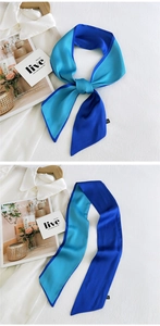 Detail of royal blue double-sided satin scarf tied in a bow on a white shirt