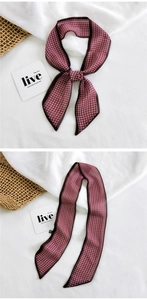 Detail of pink houndstooth narrow silk scarf used as a decorative bow for accessories