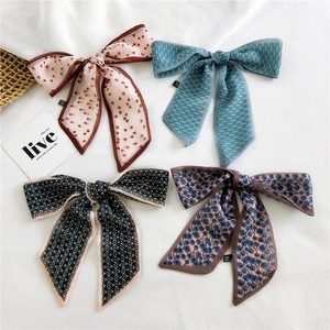 Set of four floral and polka dot skinny silk scarves for hair styling and bag decoration