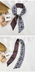 Detailed view of a long silk twilly scarf with purple geometric patterns and grid design