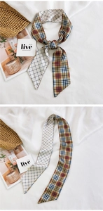 Detail of double-sided silk scarf with classic plaid and minimalist grid patterns