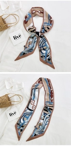 Detailed views of a long printed silk scarf used as a hair tie and bag handle accessory