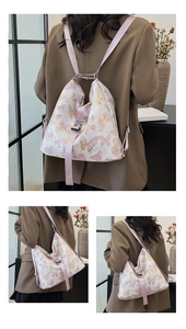 Detail view of butterfly print backpack with adjustable straps and metal buckles