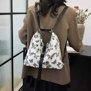 Multi-purpose white shoulder bag with gold butterfly prints and wide black strap
