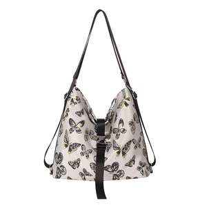 Stylish large capacity shoulder bag with elegant gold and black butterfly prints