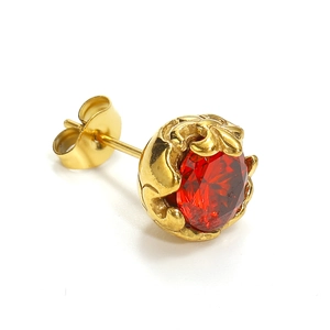 Boucle d'oreille ronde dorée de luxe avec zircon rouge rubis et détails gravés