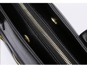 Detailansicht des Leder-Tote-Bag-Reißverschlusses mit goldener Hardware und Narbung