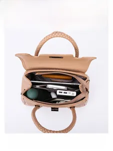 Brown crocodile texture handbag interior showing large capacity for iPad and daily items
