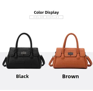 Crocodile embossed handbag display in black and brown with woven handles and metal locks