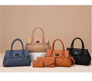Detail view of crocodile pattern handbag set in four colors with matching wallets