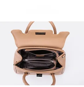 Internal layout of brown textured leather handbag showing compartments and lining