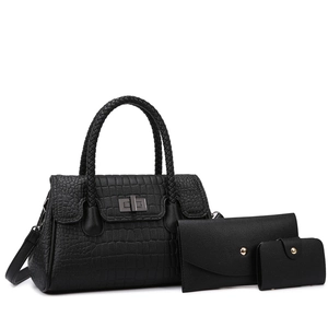 Detail view of black crocodile pattern tote bag set with envelope clutch and coin purse