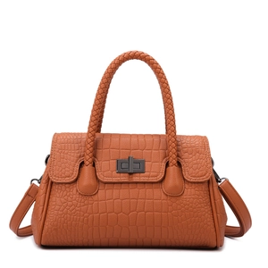 Brown crocodile embossed tote bag with woven handles and metal twist lock closure