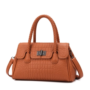 Crocodile embossed brown handbag with woven handles and metallic turn-lock closure