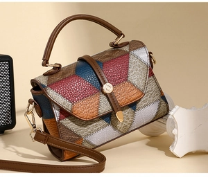 Detail view of multicolored patchwork leather bag with crocodile and ostrich textures