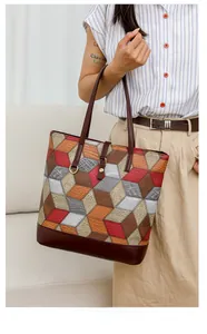 Detailed view of geometric patchwork PU leather tote bag with multi-color textured panels