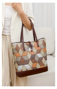Detail of multi-color geometric patchwork tote bag with high-quality leather textures