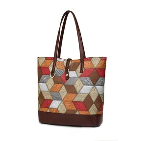 Detail of geometric diamond patchwork tote bag with high-quality leather stitching