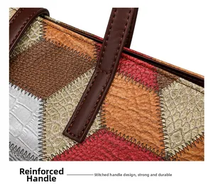 Detail of reinforced handle stitching on multi-color embossed leather tote bag