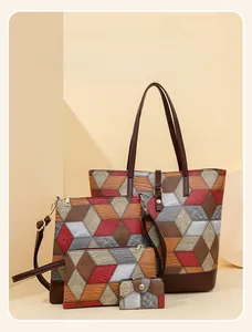 Close-up of a 4-piece handbag set with geometric patchwork and faux leather texture