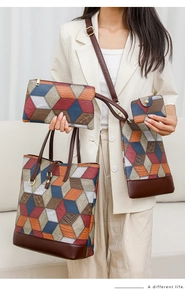 Detailed close-up of a 4-piece geometric patchwork tote set featuring lychee grain leather