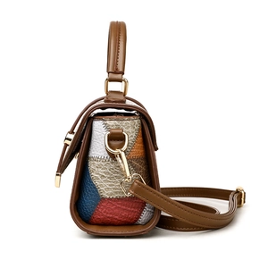 Multi-color patchwork leather crossbody bag with top handle and pebble grain finish