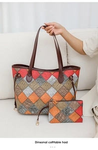 Detail view of multicolored tote bag with crocodile pattern and matching small zipper pouch