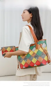 Detailed view of women's tote bag set with vibrant snakeskin pattern and leather textures