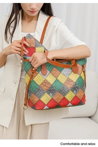 Detail view of multicolored patchwork tote bag with crocodile pattern and inner pouch