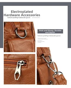 Detail view of electroplated gold hardware and lychee grain leather on brown bag