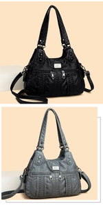 Detail of soft washed leather handbag in black and grey with woven texture and zipper